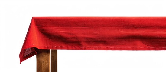Poster - Brown wooden table covered with a red tablecloth, isolated on a white background, with copy space image.