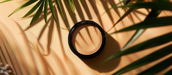 Sticker - Top view of a modern cosmetic scene featuring bronzer powder and palm shadow overlay, with copy space image.