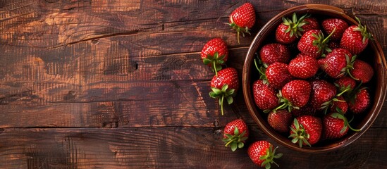 Wall Mural - Table with juicy ripe strawberries arranged as a copy space image in the background.