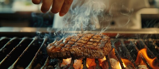 Poster - Grilling a beef steak at a restaurant with a copy space image available.