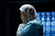 © Seventyfour - Side view portrait of exhausted female surgeon rubbing eyes after long day of work in hospital copy space