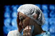 © Seventyfour - Side view portrait of mature woman as tired female surgeon taking break in operating room copy space