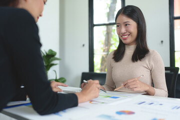 Wall Mural - Business team meeting Discuss strategy planning and calculating revenue performance with a new project plan. Financial and economic graphs with successful teamwork.