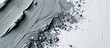 © Gular - Top view of a gray cosmetic smudge on a white backdrop with a stroke of clay, providing ample copy space in the image.