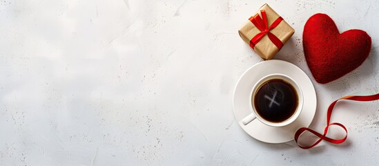 Wall Mural - Valentine's Day postcard featuring a red heart, gift, and coffee on a white table with copy space image.