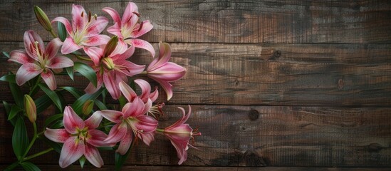 Poster - Old wooden background with pink lilies, featuring copy space image.