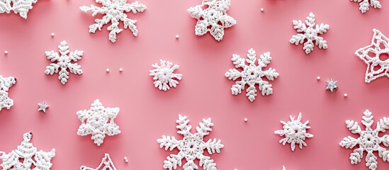 Aufkleber - Crocheted white snowflakes and stars arranged on a pink background in a Christmas-themed composition with a top-down view, flat lay presentation, and space for inserting images