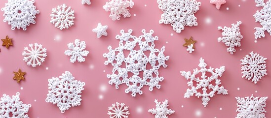 Aufkleber - Crocheted white snowflakes and stars arranged on a pink background in a Christmas-themed composition with a top-down view, flat lay presentation, and space for inserting images