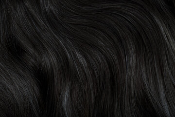 Sticker - Brunette or black hair. Female long dark hair in black. Beautifully laid curls. Closeup texture in a dark key. Hairdressing, hair care and coloring. Shading gray hair. Background with copy space.