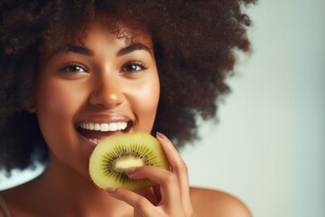 Wall Mural - Eating slice of kiwi biting smile photo.