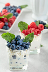 Wall Mural - Cottage cheese with cream, raspberries, and blueberries.