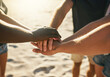 © Stratford/peopleimages.com - People, hands together and beach with team for motivation, community or solidarity in nature. Closeup of group or friends piling in diversity on outdoor mission for inclusion, collaboration or unity