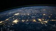 © venusvi - A satellite view of Earth at night with vibrant city lights and the infinite darkness of space