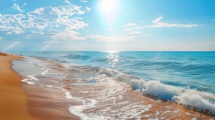 Wall Mural - Rolling waves with sun glistening off the water, approaching a pristine sandy beach