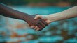 © เลิศลักษณ์ ทิพชัย - An international peace day handshake between a black and white hand was held to promote communication, rapprochement, and common goals.