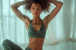 © Andromeda - A woman doing yoga on the mat for a sportswear .
