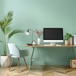 © DeepView - Modern home office interior with mint green wall, desk and computer mock up, simple decor, professional work space concept
