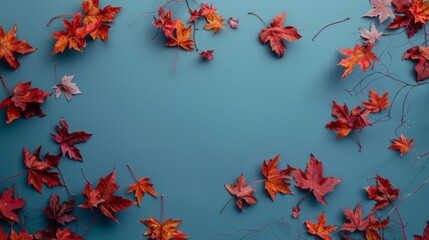 Wall Mural - Wallpaper features maple leaves arranged with space for letters, on a blue background.