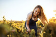 © Stratford/peopleimages.com - Farming, growth and sustainability with woman in field to harvest organic produce in season. Agriculture, smile and vegetation with farmer person outdoor in countryside for agro or agribusiness