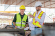 © Poguz.P - Engineer and foreman worker team inspect and checks inventory the construction site, Site manager and builder at a construction site