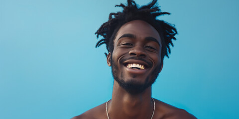 Happy man portrait on blue background, a natural portrait of a man expressing happy