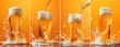 © StellaPattaya - glass of lager beer with foam, collection of draft beer on a yellow background, beer splashes