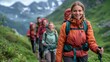 © elita888 - A vibrant and joyful group of hikers walking uphill, smiling and looking directly at the camera