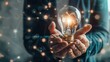 © arttools - Illuminating Financial Ideas: A Man Holds a Lightbulb Filled with Coins