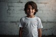 © SHERAZI - Portrait of a boy dark hair with brown eyes in a white T shirt smiling. Creative banner. Copyspace image