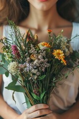 Wall Mural - a woman collects various medicinal herbs. Selective focus