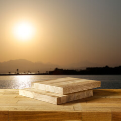 Wall Mural - Wooden table on the sunset background. Empty timper plank and copy space for products and decorations.