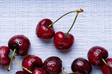 Poster - Fresh red cherries fruit. Fresh organic berries with leaves macro. Large collection of fresh red cherries. Ripe cherries background. Lot of red ripe cherries close up with water drops.