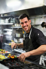 Wall Mural - chef preparing food in the kitchen