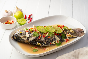 Wall Mural - Steamed Tilapia Fish In Spicy Lime Soup.Thai food