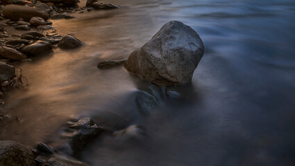 Canvas Print - water flowing over rocks