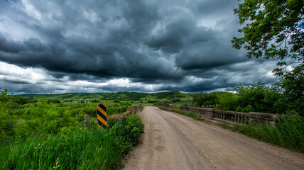 old stone bridge with stormy skies