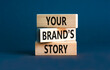 © Dzmitry - Branding and your brand story symbol. Concept words Your brands story on beautiful wooden blocks. Beautiful grey table grey background. Business branding your brand story concept. Copy space.