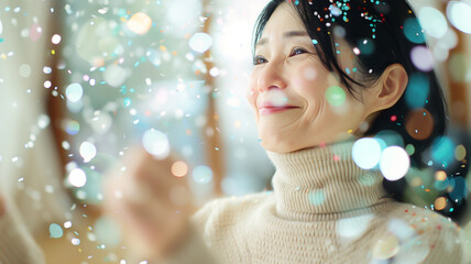 Wall Mural - Retired Asian woman in a beige turtleneck sweater Celebrating in her living room blurred in bokeh