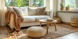 © Ihor - A living room interior with a white sofa, a knitted throw, and a round ottoman