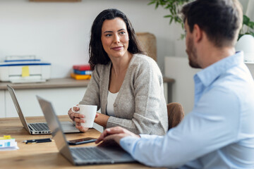 Canvas Print - Smart business people working together with laptop while talking in the coworking place.