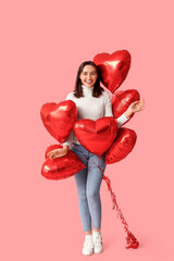 Wall Mural - Beautiful young woman with air balloons in shape of heart on pink background. Valentine's Day celebration