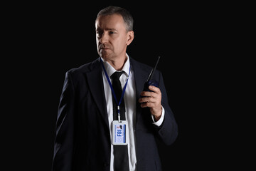 Sticker - Mature FBI agent with two-way radio on black background