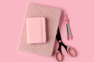 Wall Mural - Notebooks, scissors and pair of compasses on pink background