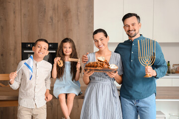 Wall Mural - Happy Jewish family with challah bread and flag of Israel in kitchen