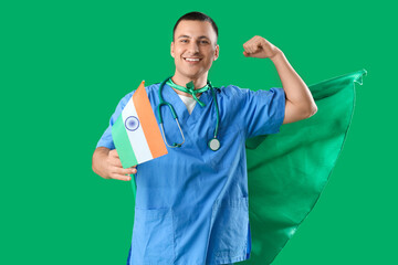 Sticker - Male doctor with flag of India and superhero cape showing muscles on green background. National Doctor's Day celebration