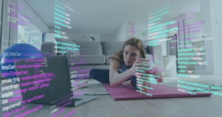 Canvas Print - Image of caucasian woman stretching, exercising with laptop and data processing