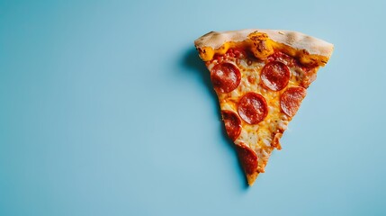 Wall Mural - Above view with a single slice of pepperoni pizza on a blue background