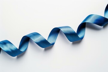 Wall Mural - Blue ribbon is laying on a white background, curled up in a wave shape