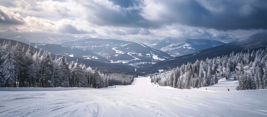 Wall Mural - Scenic View of Snow-Covered Mountains from Ski Slope under Cloudy Sky
