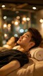 © A Denny Syahputra - A man rests on a massage table with a rolled towel